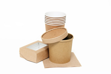 Eco kraft paper tableware. Paper cups, dishes, fast food containers, paper napkins isolated on white background. Recycling concept. Zero waste.