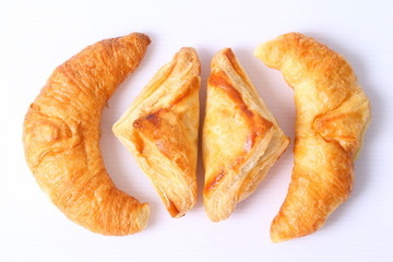 Fresh and tasty croissant over white background