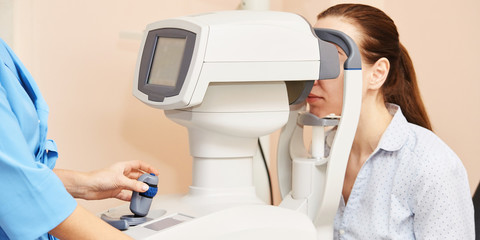 ophthalmologist doctor in exam optician laboratory with female patient. Eye care medical...
