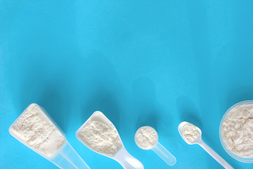 fish collagen peptides powder. different scoops of powdered collagen for beauty and health care....