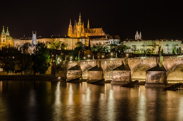 Fototapeta na wymiar Charles Bridge and St Vitus Cathedral at night in Prague Czech Republic