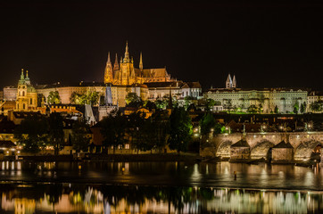 Charles Bridge and St Vitus Cathedral at night in Prague Czech Republic