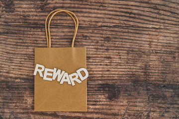 customer rewards and fidelization incentives, shopping bag with price tag with Rewards written on it