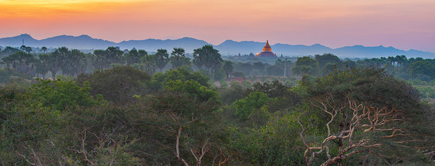 Scenic and stunning sunrise at Archaeological Zone over Bagan in Myanmar. Bagan is an ancient city...