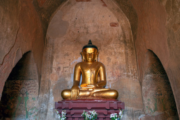 Ancient Buddha Image Statue at Dhammayan Gyi Temple in Bagan, Myanmar. Bagan is an ancient city and World Heritage Site certified by UNESCO with thousands of historic buddhist temples