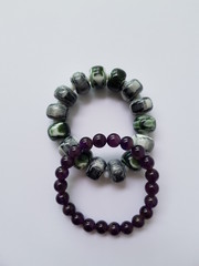 Closeup of colorful bead bracelets white background.  Ornament concept.