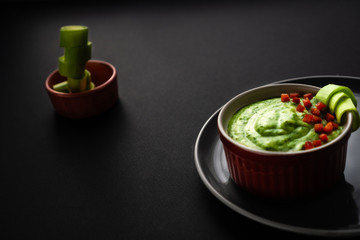 Healthy food with fresh green vegetables in a consistency of spinach and broccoli strips