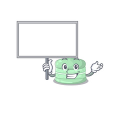 A cute picture of pistachio macaron mascot design with a board