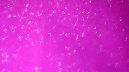 Blurred abstract photo of light burst and glitter golden bokeh lights.  