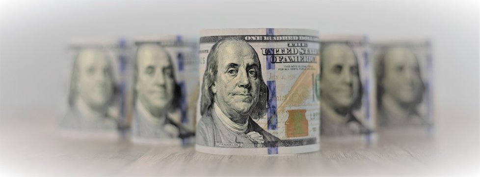 Macro shot of a 100 dollars bills. Dollars Closeup Selective Focus. American Cash Money. One Hundred Dollar Banknotes. Onre hundred Bucks. Benjamin Franklin's portrait on 100 dollars bills.