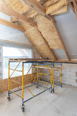 New house under construction with rockwool insulation