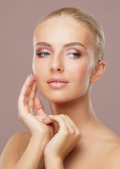 Beautiful face of young and healthy woman. Skin care, cosmetics, makeup, complexion and face lifting.