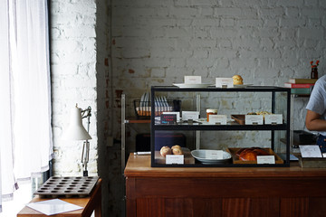 Interior design and decoration of coffee shop and bakery bar -decorated with display showcase box...