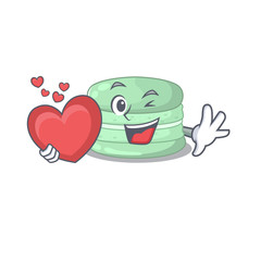 Romantic pistachio macaron cartoon picture holding a heart