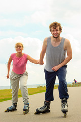 roller skater couple skating outdoor