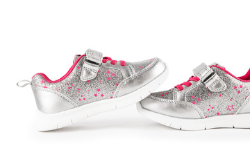 flat lay. the silver children's sports shoes isolated on a white background