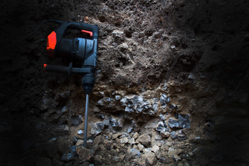 Power tools. Hammer drill. Breaks the rock