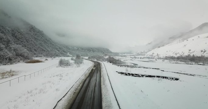 Aerial view of snowy road and landscape