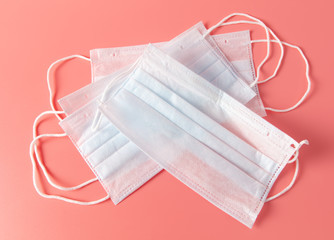 Medical mask isolated on a pink