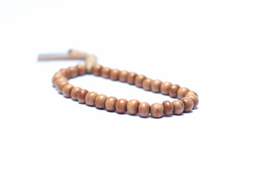wooden prayer beads on white background