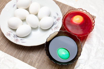 Painting eggs in the kitchen.