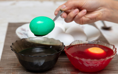 Painting eggs in the kitchen.
