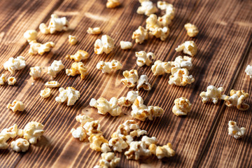 Popcorn flakes on a wooden background