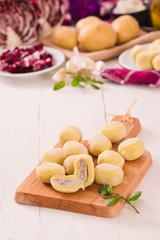 Potato gnocchi stuffed with radicchio and ricotta.
