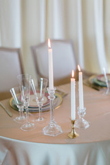 Elegant Table Setting with Candles at Wedding Reception - 328228262