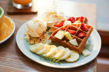 Waffle of fresh berries  strawberry, blueberry, bananas and chocolate topping,Sweet dessert cafe
