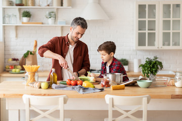 father and son having breakfast