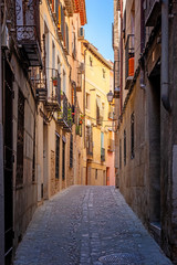 Toledo. Spain. Cozy medieval cobbled narrow street