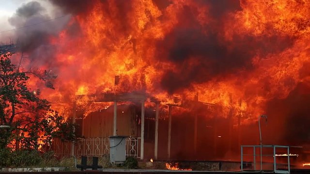 big fire with black smoke aerial top panoramic view sky fly