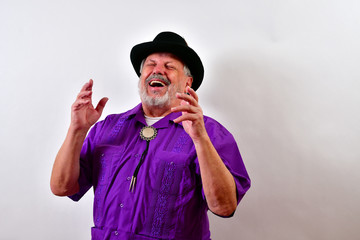 Happy old man is laughing..Elderly gentleman laughing wiht his eyes closed
