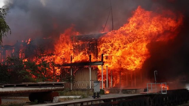 big fire with black smoke aerial top panoramic view sky fly