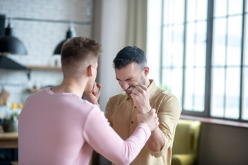 Two young men fighting and looking agressive