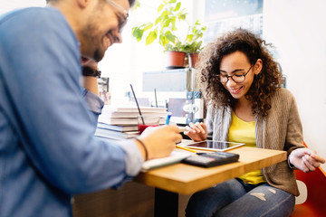 Group of students study at library. Learning and preparing for university exam.