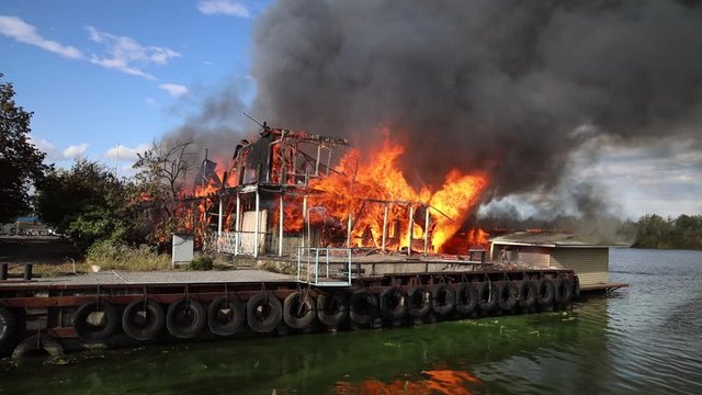 big fire with black smoke aerial top panoramic view sky fly