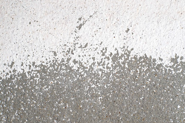 White paint surface texture of the cement wall that peels off close-up background.