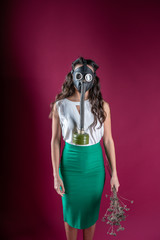 girl in a gas mask. against viruses. epidemic. radiation. protection against bacteria. coronavirus.