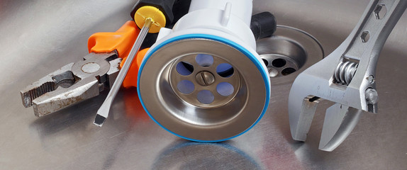 plumber tools and drain assembly in stainless kitchen sink, suitable for header or banner