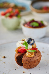 Delicious cupcakes with delicate caramel filling inside, decorated with fresh fruit.