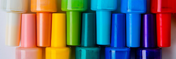 colored nail polishes on a white background