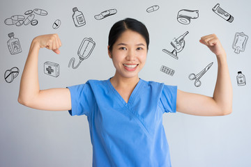 Female nurse showing biceps with hand drawn medical sketches. Metaphor of strength for hard health...