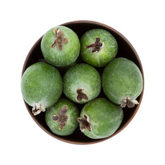Green feijoa fruits isolated on white background. Scientific name Acca sellowiana. Top view. Healthy and balanced diet eating concept. Fresh fruits concept.