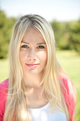 Happy young woman on a meadow