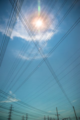 Fototapeta premium Electricity pylons and high-voltage power lines , the background of beautiful sky, Electrical Power Grid.