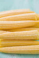 baby corn on wooden surface