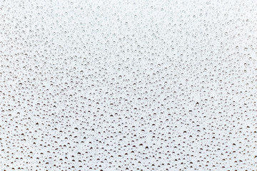 raindrops on glass natural color background.