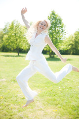 Happy young woman in a park